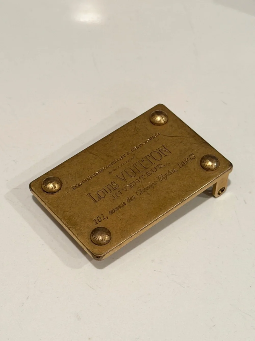 2 Luis Vuitton belt buckles
